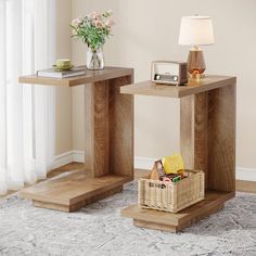 two wooden tables sitting on top of a carpeted floor next to a lamp and window