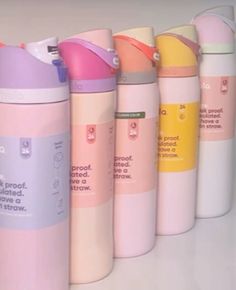 thermos bottles are lined up in a row