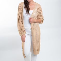 Beat the chill in style with the Enya Long Crochet Cardigan. Featuring a trendy neutral sepia tone with an open crochet detail, this cardigan is easy to wear and certain to become your spring go-to. This long sleeve sweater is perfect for your Spring and Summer wardrobe, throw over your favorite top with a pair of leggings or skinny jeans with some sandals and necklace for a classic look! This top is a light weight sweater, it will give you enough warmth and comfort in a cool day without looking Long Open Knit Outerwear For Summer, Lightweight Cardigan For Beach In Fall, Summer Open Knit Outerwear With Open Front, Summer Open Front Open Knit Outerwear, Trendy Open Knit Outerwear With Open Front, Fall Beach Open Knit Outerwear, Trendy Open Front Open Knit Outerwear, Long Beige Cardigan For Spring, Trendy Open Front Sweater With Open Knit