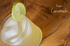 a close up of a drink on a wooden table