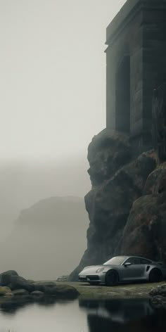 two cars parked on the side of a cliff