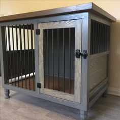 a wooden cabinet with metal bars on the doors