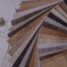 many different types of wood flooring samples are arranged in order to be used on the floor