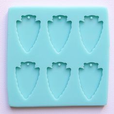 an ice tray with six different shapes on it