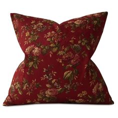 a red pillow with floral print on the front and back, sitting on a white background