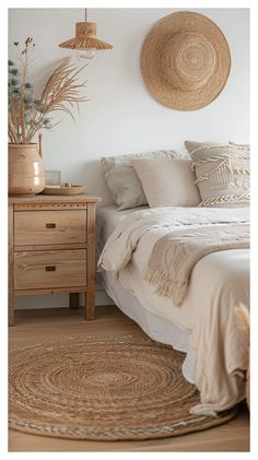 a bedroom with white walls and wooden furniture