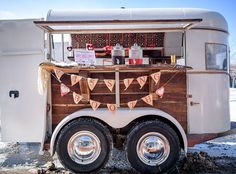 the food truck is decorated with buntings and decorations on it's sides