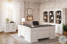 a white desk sitting on top of a hard wood floor next to a book shelf