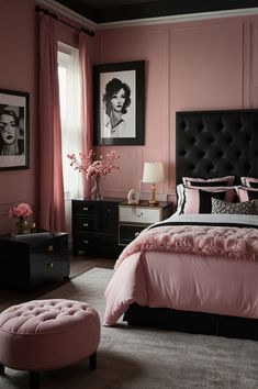 a bedroom decorated in pink and black with pictures on the wall above the bed, along with a footstool