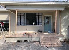 the front porch is being remodeled and ready to be used as an outdoor living space