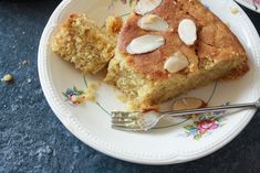 a white plate topped with two pieces of cake