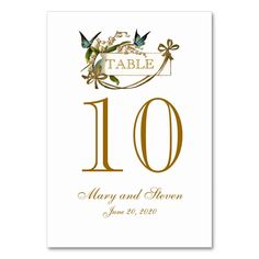 the table numbers are gold and white, with flowers on each one side that reads 10