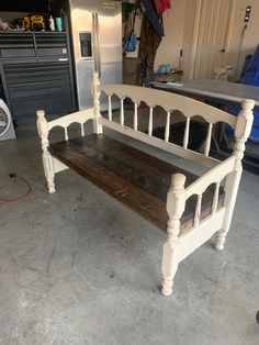 a white bench sitting inside of a garage