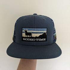 "It's Rodeo Time All The Time Ol' Son, So You Better Get You A Dale Brisby Cap And Let 'Em Know. You Ain't No Cowboy If You Don't!" Casual Blue Hats For Rodeo, Blue Outdoor Hat, Fitted Blue Outdoor Hat, Adjustable Blue Trucker Hat For Rodeo, Blue Adjustable Trucker Hat For Rodeo, Blue Snapback Trucker Hat For Rodeo, Blue Snapback Hat For Rodeo, Dale Brisby, Michael Jordan Autograph