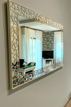 a mirror that is hanging on the wall