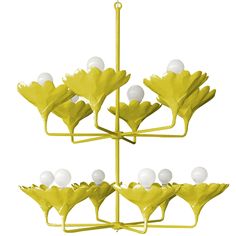 a yellow and white chandelier with flowers on it