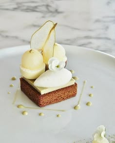 a white plate topped with cake covered in icing