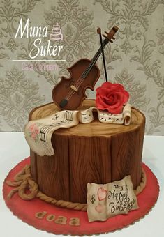 there is a cake that has a violin on it