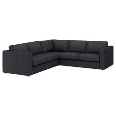 a black sectional couch sitting on top of a white floor