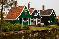 a row of houses next to a body of water