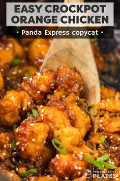 an easy crockpot orange chicken recipe in a pan with a wooden spoon