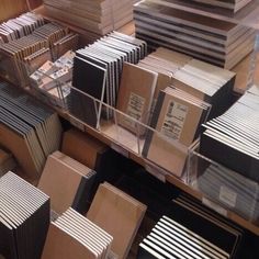 several stacks of wooden boxes on display in a store