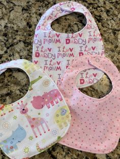 These bibs make the perfect gift for any baby girl. They are made out of soft flannel with a water proof backing to keep clothes underneath clean and dry. Pink Cotton Bib As A Gift, Pink Cotton Bib As Gift, Cute Handmade Cotton Bib, Cute Cotton Bib For Playtime, Pink Cotton Bib Machine Washable, Pink Cotton Machine Washable Bib, Cute Pink Bib As A Gift, Cute Pink Bib For Gift, Cute Pink Bib As Gift