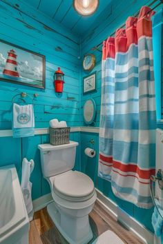 a bathroom with blue walls and wood floors