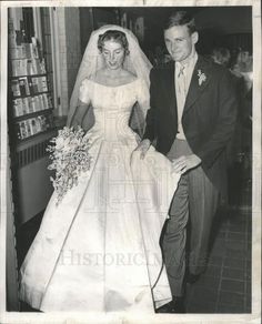 an old black and white photo of a bride and groom