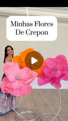 a woman is standing in front of some paper flowers with the caption, minaas floress de crepon