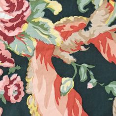 an image of a flowery fabric with many colors and flowers on the back ground