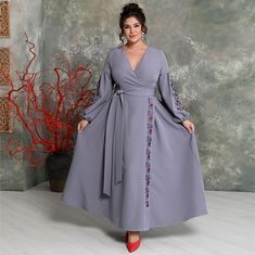 mmerse yourself in a world of luxury with our evening dress that captivates at first glance. This stunning wrap-style dress promises to highlight your femininity and elegance.   Embroidery made from gray and red silk threads skillfully adorns the sleeves and skirt, adding a unique charm and style to the look. The wide belt not only accentuates the waist but also adds refinement to the silhouette.   charm and sophistication. The sleeves are voluminous, with elastic at the cuffs The long and voluminous skirt, which flows beautifully with every movement, impresses with its grace and sophistication. This dress is the perfect choice for special occasions where you want to be the center of attention. Fabric: Barbie modal (high-quality suiting fabric of Korean origin with added elastane). Due to Voluminous Skirt, Skirt Elegant, Dress With Embroidery, Evening Dress Fashion, Wide Belt, Red Silk, Dress Clothes For Women, Style Dress, Wrap Style