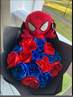 a spiderman bouquet made out of red, white and blue flowers