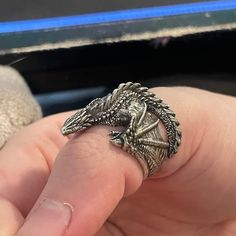 This beautiful Dragon ring is cast in 925 silver and shipped inside a beautiful stained wooden box. This ring is adjustable but please verify ring size so I can send you a ring that fits properly. Per the photos, some parts of this ring can be sharp and get caught on clothing. These rings are all handmade to order so each ring may have slight differences. Handmade in the USA of 925 silver. Also available in 24k gold plated! This is pure 24k gold that is plated to a thickness of 1 micron. minimum jewelry standard is 0.5 microns so I do double for longevity. Check out my YouTube channel for how the process works. Please verify ring size before ordering. Resizing is not possible for custom rings. Returns will only be accepted within 7 days of receipt and with receipt of the original price in Unique Carved Rings As Gifts, Unique Carved Rings For Gifts, Unique Sterling Silver Snake Ring As Gift, Antique Carved Rings For Gifts, Antique Carved Rings Perfect For Gifts, Antique Carved Rings As Gifts, Sterling Silver Engraved Open Ring Collectible, Antique Carved Rings For Gift, Sterling Silver Engraved Open Ring For Collectors