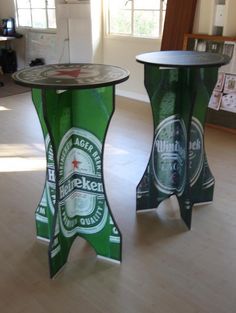 two tables made out of beer bottles on the floor in a room with wood floors