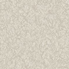 a beige and white wallpaper with small scratches