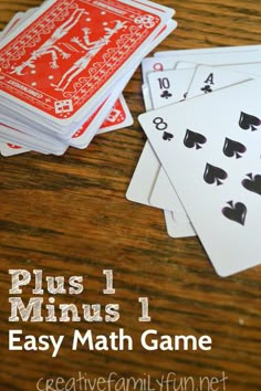 four playing cards with the words, plus 1 minus 1 easy math game on them