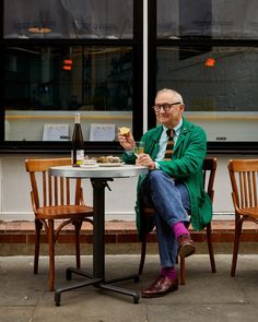 a man sitting at a table eating food