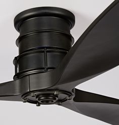 a close up view of the blades on a ceiling fan that is black in color