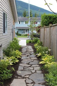 a stone path in front of a house