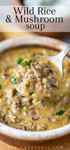 a spoon full of wild rice and mushroom soup