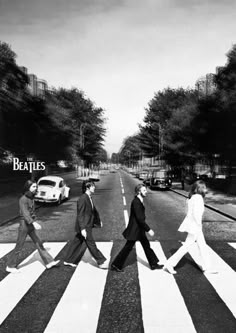 the beatles are walking across the street