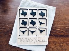 there is a napkin with some cut outs on it that say tic - tac - tacs