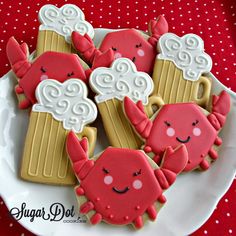 some decorated cookies are on a white plate