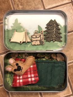 two tins filled with different types of items