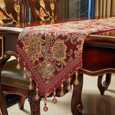 a table with a red and gold cloth on it