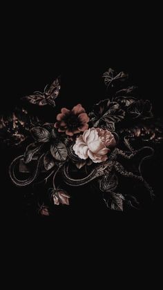 a black background with flowers and leaves on the bottom right corner, in the middle