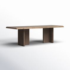 a wooden table sitting on top of a white floor