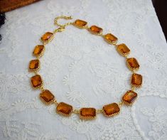 Orange Topaz is such a classic color.  These vintage Czech crystal stones make wonderfully unique and versatile collet necklaces.  I put these lovely stones into my favorite settings, custom made for me, with elaborate crown prongs and offset loops to prevent them from flipping. They are open-backed settings, which is a great way to present these beautiful stones.  The light just makes them sparkle! Stone Size: 18x13mm / .70 inches / 1.8cm each Stone Material: Vintage Crystal Orange Topaz.  Settings: Heavy cast Brass with your choice of plating (Gold plate is shown), offset loops to prevent the settings from flipping around and showing the back.  Length: 16" (40.6cm) with a 2" extender chain for flexible sizing Can be ordered with matching earrings- you may select that option at checkout! 18th Century Jewelry, The September Issue, Topaz Yellow, Crown Necklace, Beautiful Stones, Sparkle Jewelry, Anna Wintour, Stone Material, Czech Crystal