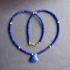 Beaded Choker Necklace Beaded With 3.5mm Genuine Blue Lapis Lazuli Hand Faceted Natural Stone, Accented With Stardust 14k Gold Filled Spacers. And Centered With Lapis Lazuli Pendant * Gemstone : Lapis Lazuli * Metal : All Metal Used Is 14k Gold Filled * Closure : Lobster Clasp * Size: 16” Inches Xmas Christmas Gift Beaded Necklace Blue, Blue Stone Necklace, Lapis Jewelry, Beaded Collar Necklace, Lapis Pendant, Lapis Necklace, Lapis Lazuli Pendant, Lapis Lazuli Necklace, Necklace Ideas